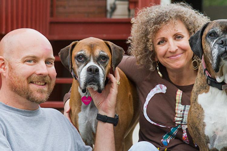 Couple with their two dogs. They run their own small animal welfare organization.