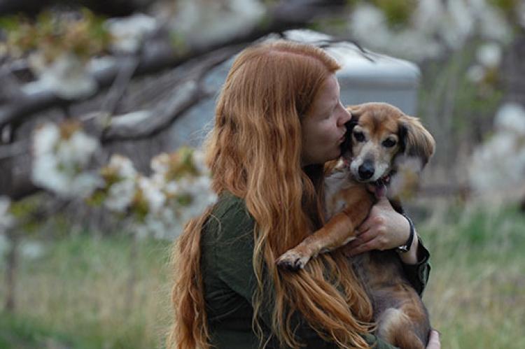 Woman with her beloved dog. The decision about when to euthanize an ailing pet is not easy.