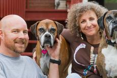 two dogs with a couple who run their own small animal rescue group